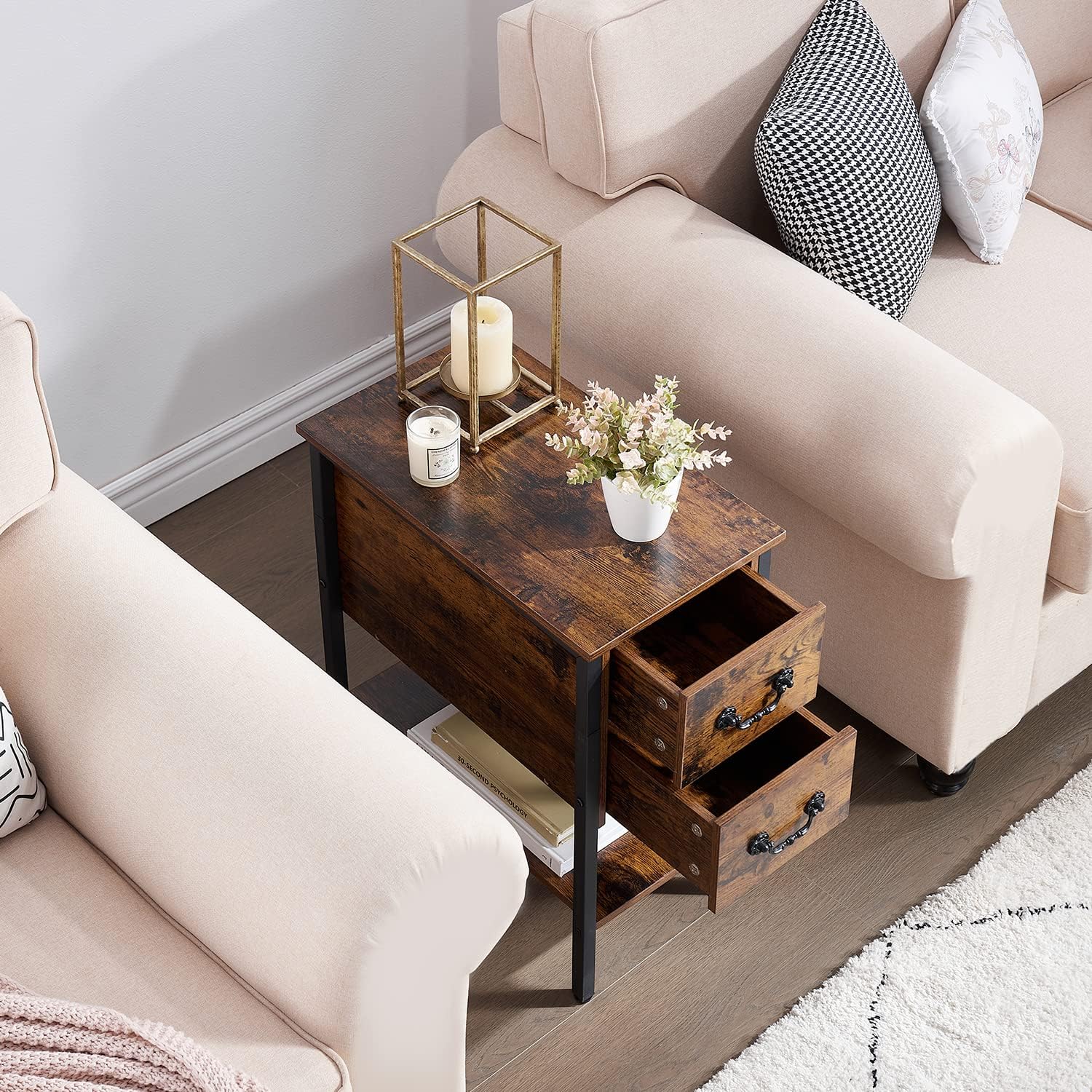 VECELO tall end table with drawers and charging station placed between two sofas, styled with candles, books, and a plant.