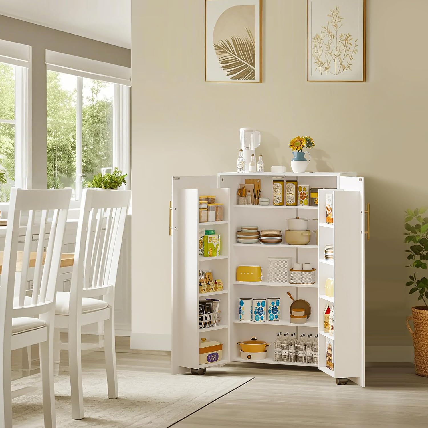 VECELO white rolling kitchen storage cabinet with double doors and open shelves, neatly organized with dishes, cookware, and pantry items, placed beside a bright dining area with white chairs and large windows.