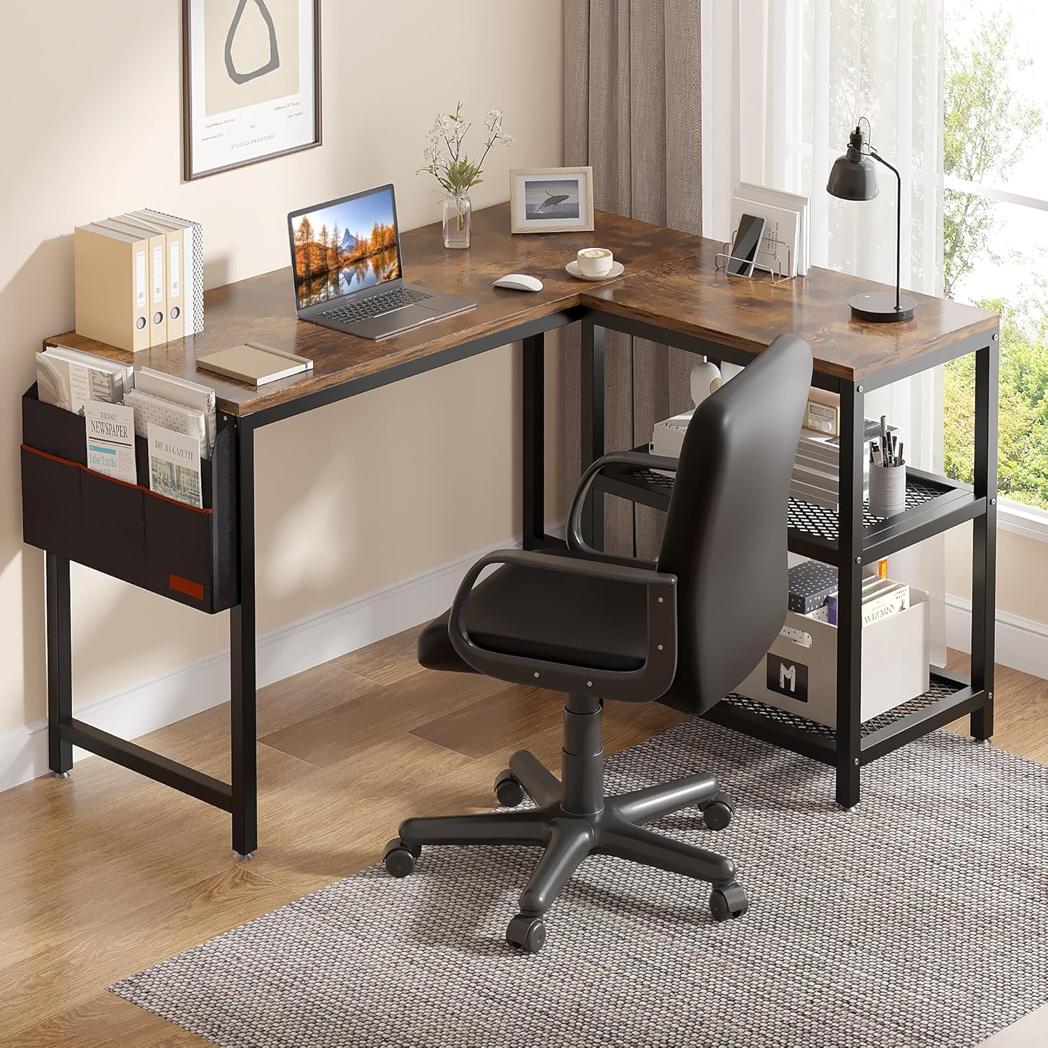 Modern L-shaped computer desk with rustic wood surface, black metal frame, side storage pockets, and shelving, set up in a bright home office with a black swivel chair.